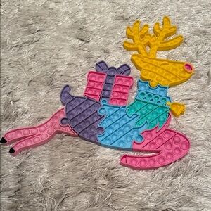 Colorful Reindeer Pop it puzzle toy that comes apart in separate pieces